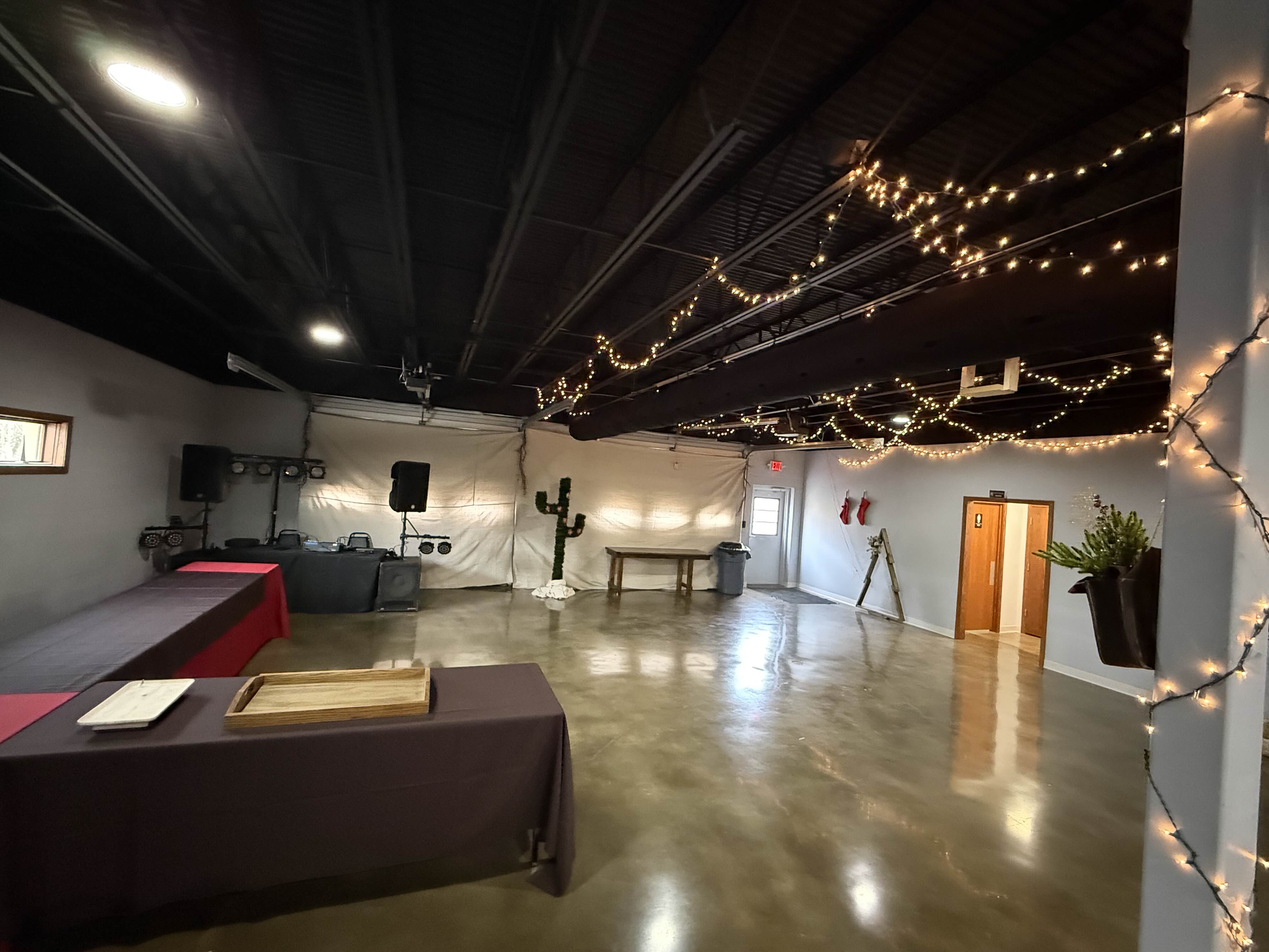 Apex Event Center setup with round tables and chairs for a formal event
