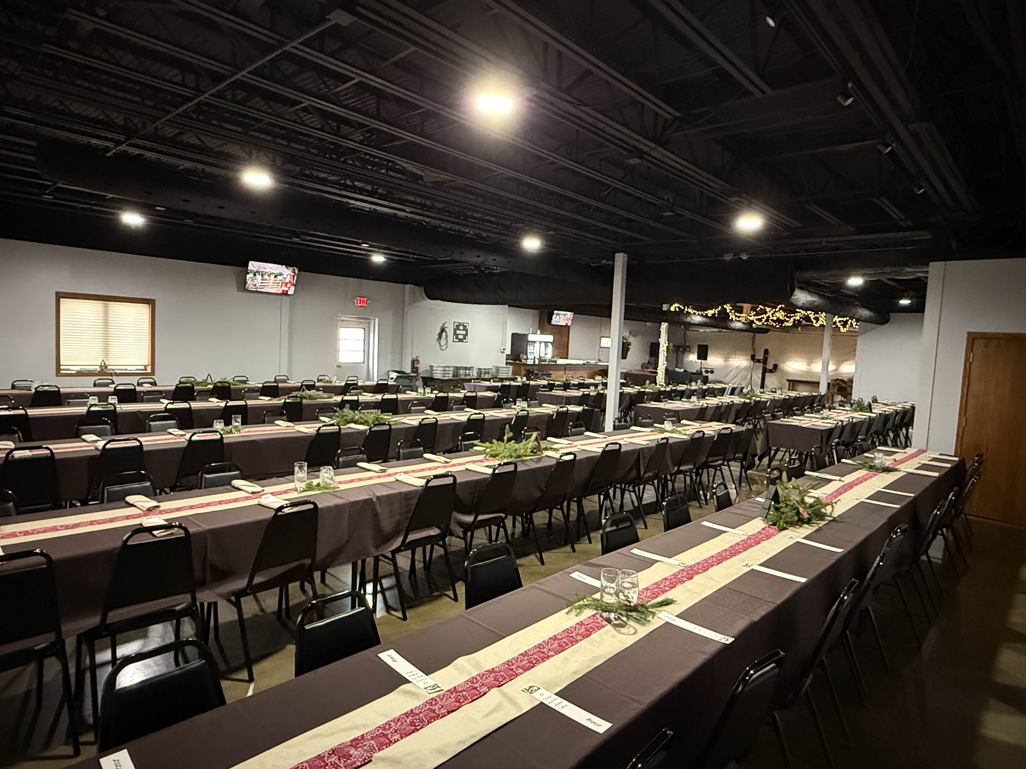 Apex Event Center decorated with festive lighting for a celebration