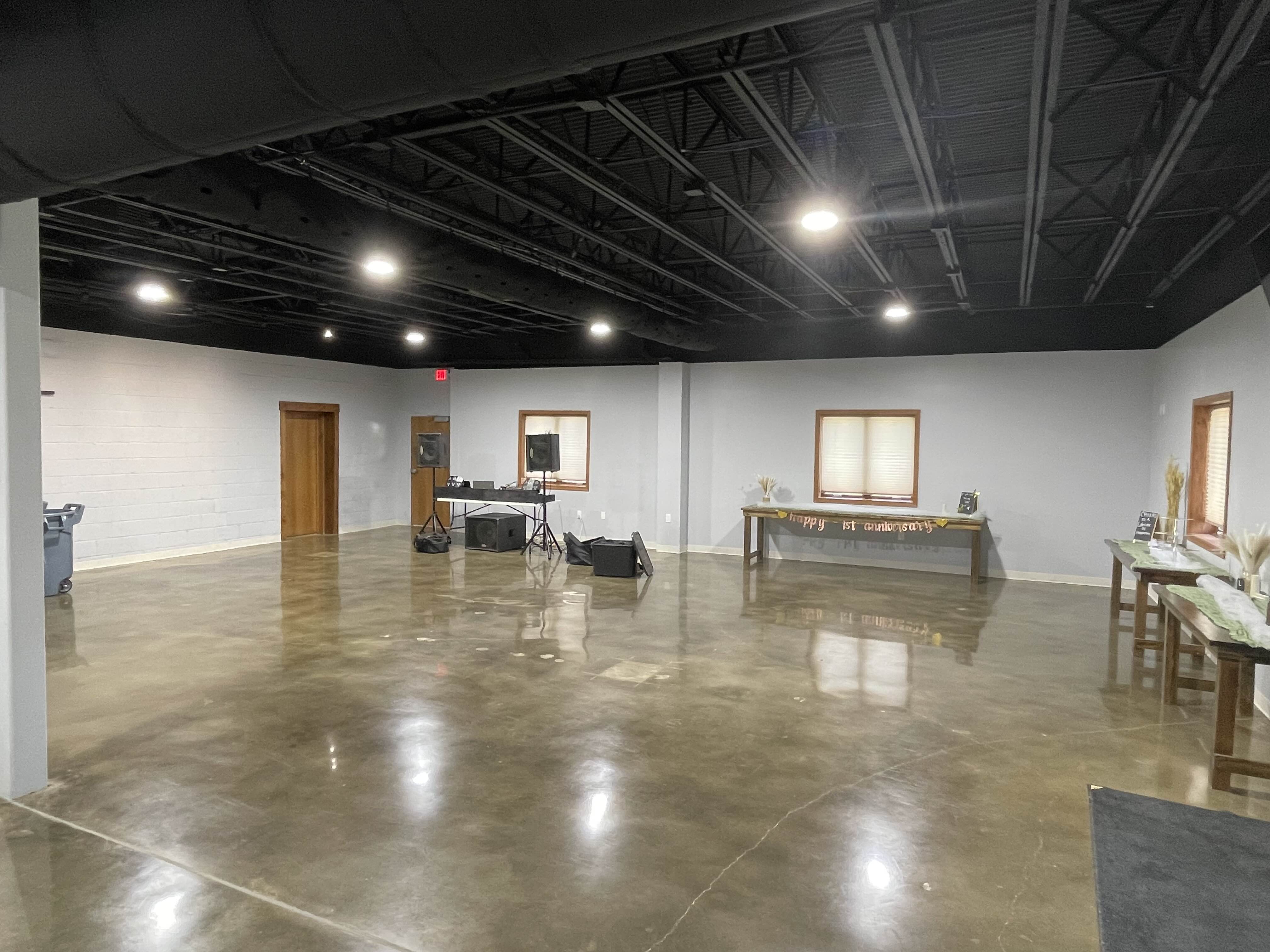 Apex Event Center prepared for a large gathering with multiple tables